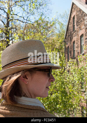 A profile of a woman wearing a hat. Stock Photo
