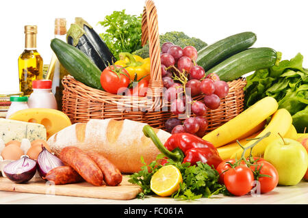 Assorted grocery products including vegetables fruits wine bread dairy and meat isolated on white Stock Photo