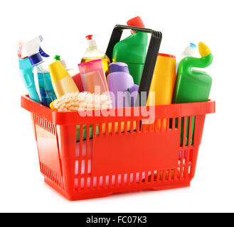 Shopping basket with detergent bottles and chemical cleaning supplies isolated on white Stock Photo