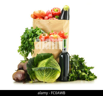 Raw vegetables and shopping bag isolated on white Stock Photo
