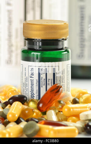Composition with dietary supplement capsules and containers. Variety of drug pills Stock Photo