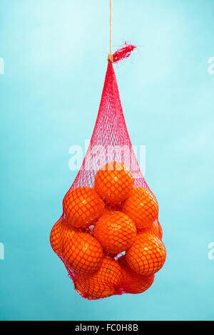 Mesh bag with tangerines stock image. Image of dessert - 138402233