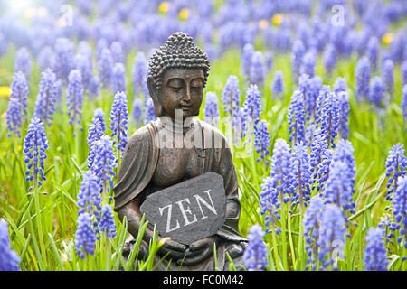 Buddha statue with the word „ZEN Stock Photo