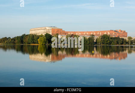 The Congress Hall reflected in still lake in Nuremberg Stock Photo