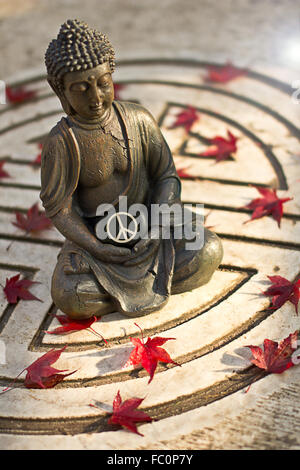 Buddha statue with the word „Peace“ Stock Photo