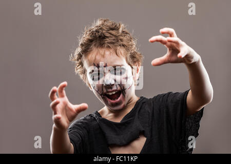 Screaming walking dead zombie child boy Stock Photo