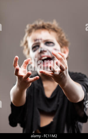 Screaming walking dead zombie child boy Stock Photo