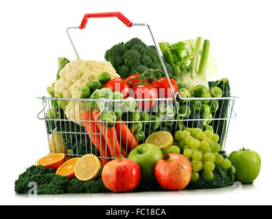 Shopping basket with assorted raw organic vegetables isolated on white Stock Photo