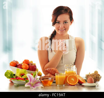 Young woman having breakfast. Balanced diet Stock Photo