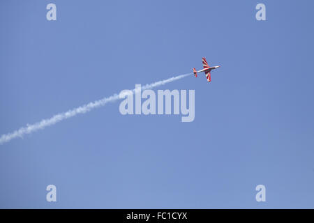 Plane on an air show against blue sky Stock Photo - Alamy