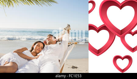 Composite image of calm couple napping in a hammock Stock Photo