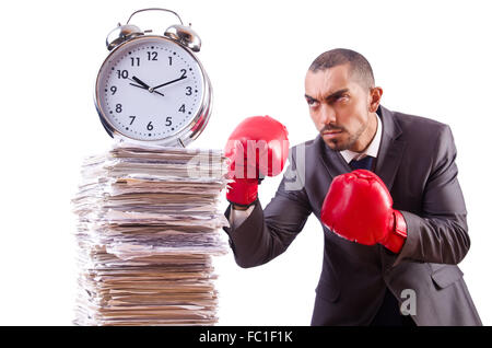 Angry businessman hitting clock isolated on white Stock Photo