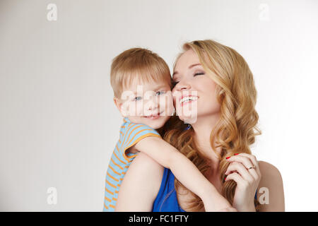 Portrait of happy mother hugging her son Stock Photo