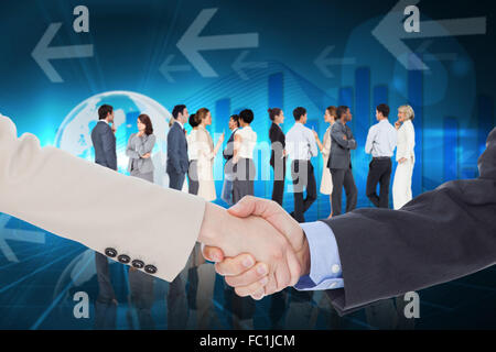 Composite image of smiling business people shaking hands while looking at the camera Stock Photo