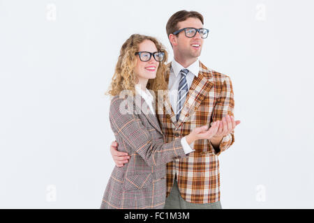 Happy geeky hipster couple holding their hands Stock Photo