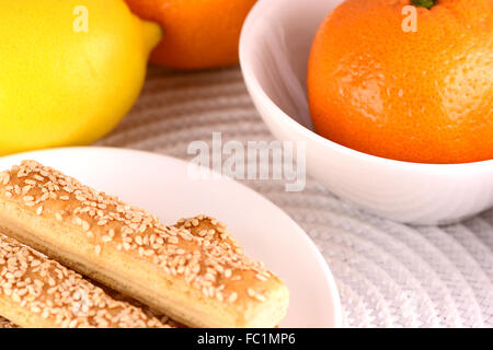 sweet cake on white plate and fruits Stock Photo