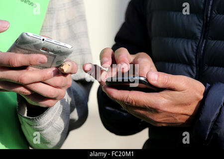 Men using Smartphones. Stock Photo