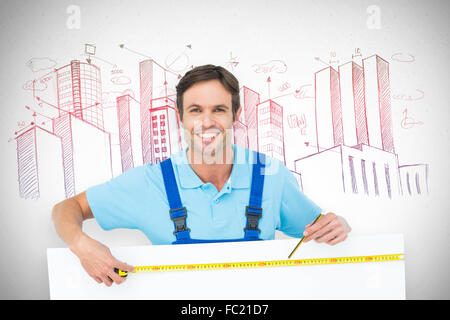 Composite image of happy carpenter measuring blank bill board Stock Photo