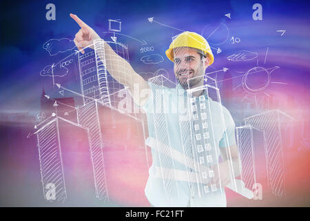 Composite image of male architect with blueprints pointing away Stock Photo