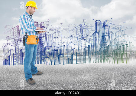 Composite image of full length of repairman using laptop Stock Photo