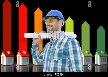 Composite image of smiling architect looking away while holding blueprint Stock Photo