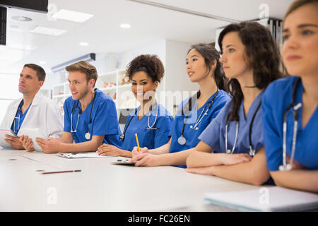 Medical student smiling at the camera during class Stock Photo