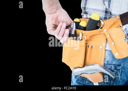 Composite image of technician with tool belt around waist Stock Photo
