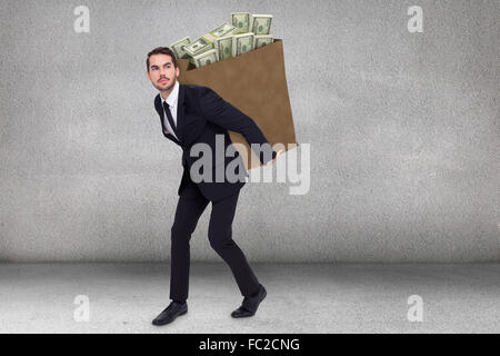 Composite image of businessman carrying something with his hands Stock Photo