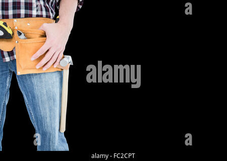 Composite image of handyman wearing tool belt Stock Photo