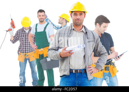 Composite image of architect looking at camera Stock Photo