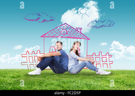 Composite image of couple both sitting on floor Stock Photo