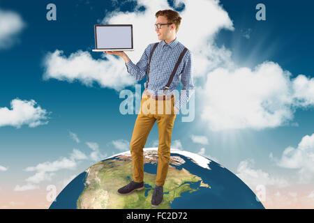 Composite image of geeky businessman showing his laptop Stock Photo