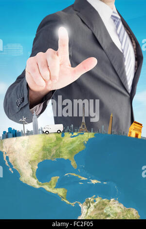 Composite image of businessman pointing with his finger Stock Photo