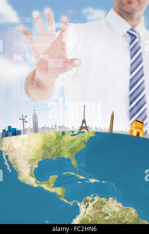 Composite image of handsome businessman gesturing with hand Stock Photo