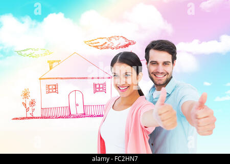 Composite image of happy couple showing thumbs up Stock Photo