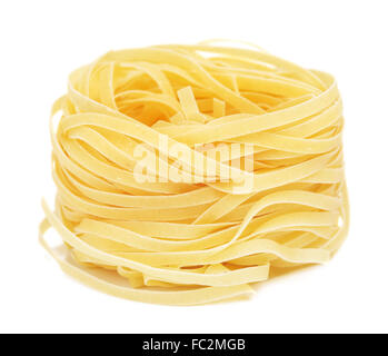 raw pasta tagliatelle nest, isolated on white Stock Photo