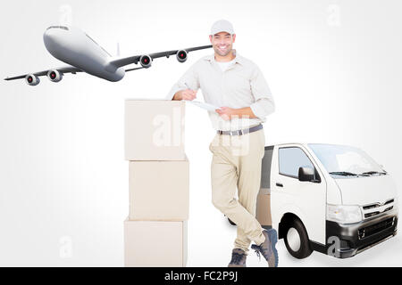 Composite image of delivery man with clipboard leaning on cardboard boxes Stock Photo