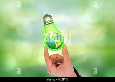 Composite image of businessman measuring something with his fingers Stock Photo