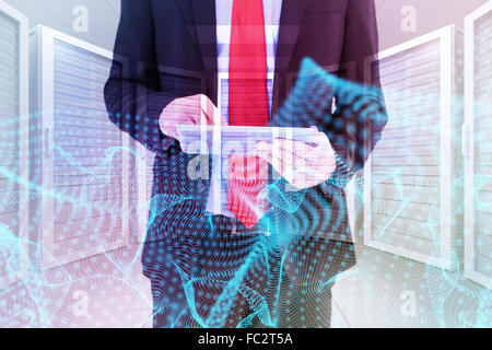 Composite image of businessman scrolling on his digital tablet Stock Photo