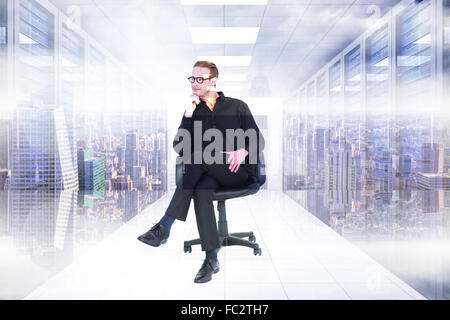 Composite image of thoughtful businessman sitting on a swivel chair Stock Photo