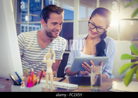 Happy young designers working together Stock Photo