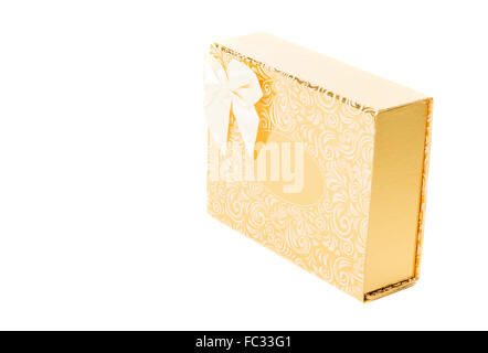 Golden gift box with bow tie side view Stock Photo