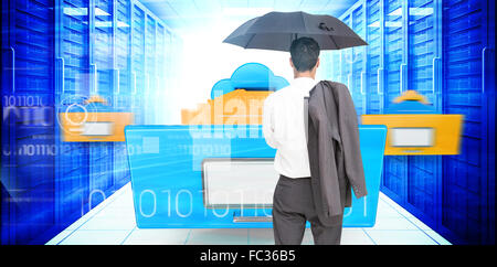Composite image of businessman standing back to camera holding umbrella and jacket on shoulder Stock Photo