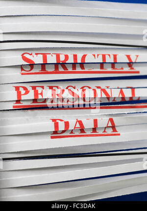 'STRICTLY PERSONAL DATA' paper through a shredder. Stock Photo