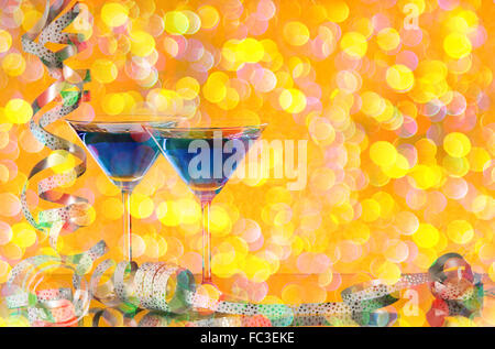 two liqueres glasse with a lot  of colored confetti Stock Photo