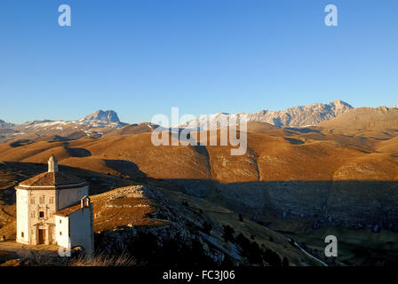 Rocca Calascio is a mountaintop fortress or rocca in the Province of L'Aquila in Abruzzo, Italy. At an elevation of 1,460 metres (4,790 ft), Rocca Calascio is the highest fortress in the Apennines.  Rocca Calascio was the location for the final scene of Richard Donner film Ladyhawke.  Sequences for The Name of the Rose and The American were also shot here.  Near the fortress, at a slightly lower elevation, is Santa Maria della Pietà, an octagonal church built in the seventeenth century. Stock Photo