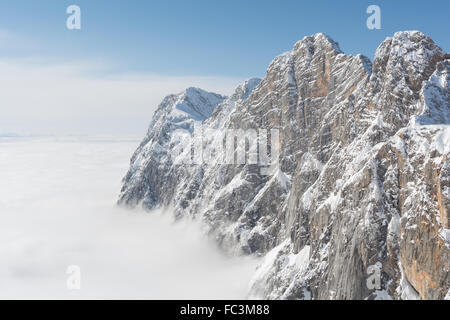 Dachstein Mountains with Sun over the clouds Stock Photo