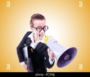 Young businessman with loudspeaker against the gradient Stock Photo