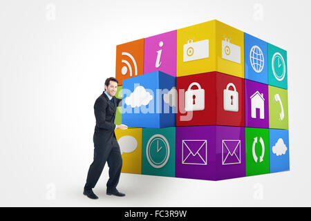 Composite image of businessman presenting with his hands Stock Photo