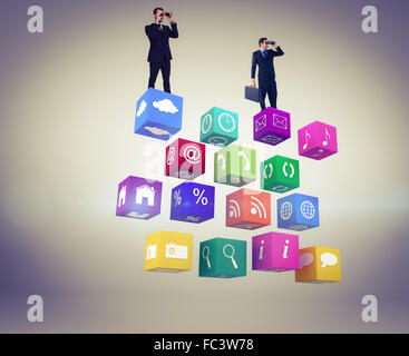 Composite image of businessman using binoculars while holding a briefcase Stock Photo